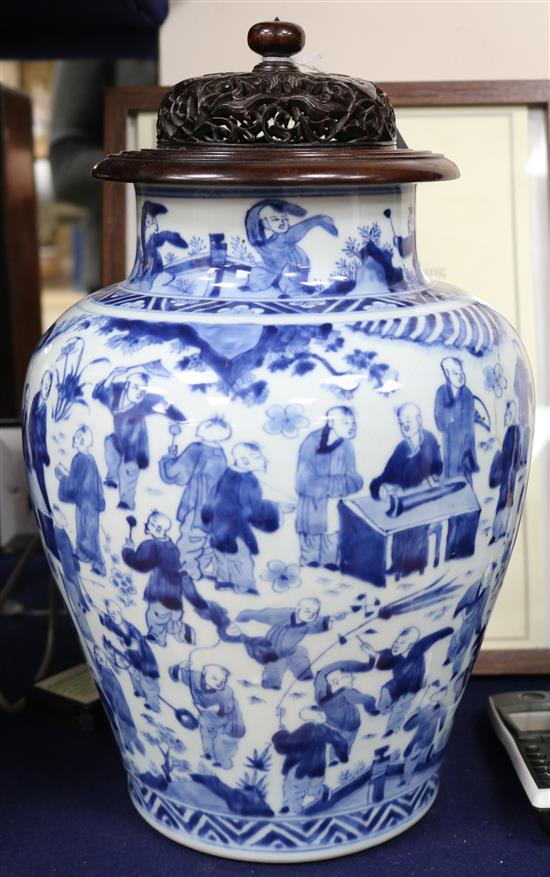 A Chinese blue and white Hundred Boys vase, Transitional period c. 1640, wood stand and cover
